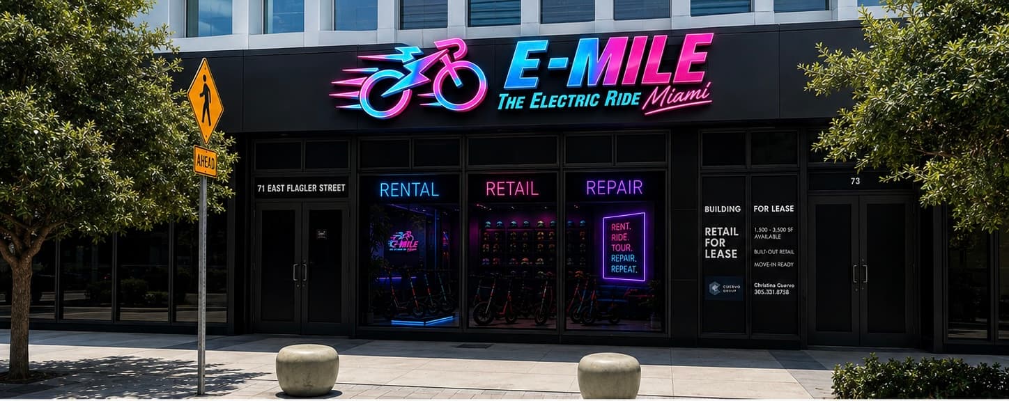 Neon-lit storefront of E-MILE The Electric Ride Miami offering rental, retail, and repair services.